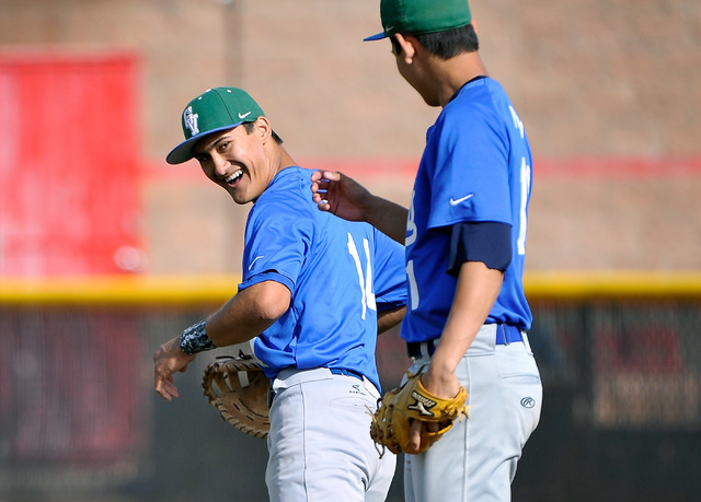 Green Valley’s Keola Paragas, left, looks back at pitcher Blake Inouye during a recent ...