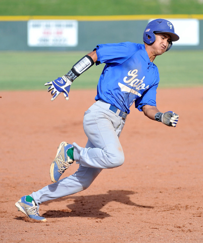 Green Valley’s Keola Paragas round third base during a recent game against Las Vegas H ...