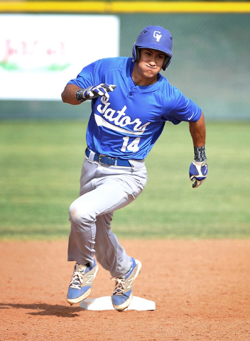 Green Valley’s Keola Paragas rounds second base on his way to a stand-up triple during ...