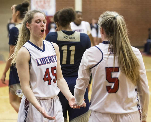 Liberty’s Amanda Pemberton (45) celebrates with teammate London Pavlica (5) on Tuesda ...