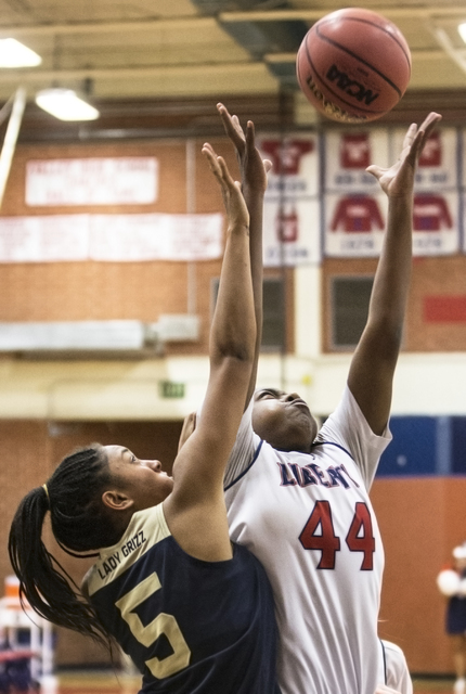 Liberty’s Dre’una Edwards (44) grabs a rebound over Spring Valley’s Bria H ...