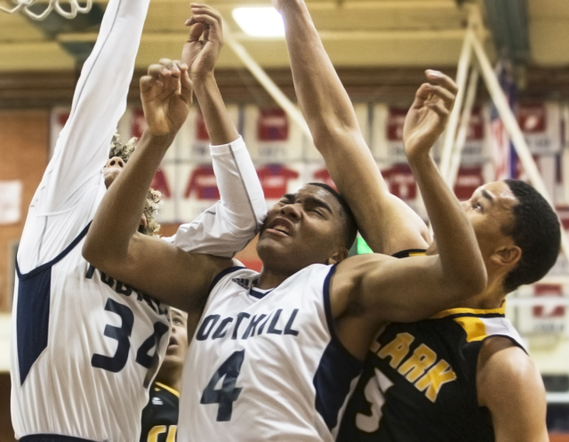 Foothill’s Mauricio Smith (4) collides with teammate Carl Fischer (34) and Clark&#8217 ...