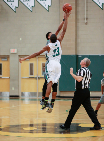 Rancho High School’s Lamont Traylor (33) starts the game jumping against Green Valley ...