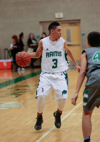 Rancho High School’s Chrys Jackson (3) moves the ball up the court during a basketball ...
