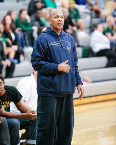 Rancho High School’s Coach Ronald Childress watches his players on the court during a ...
