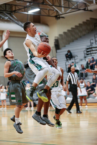 Rancho High School’s Chrys Jackson (3) takes a shot against Green Valley earlier this ...