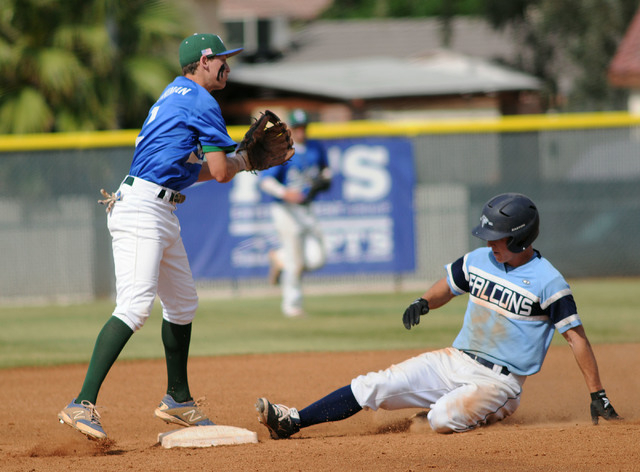 Foothill’s Ryan Moyes slides safely into second base as Green Valley’s Jarod Pen ...