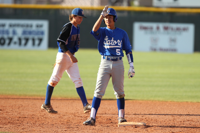 Green Valley’s Eric Samson (5) slides safe for a double in the fourth inning of their ...