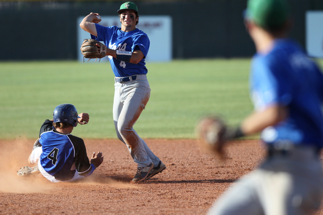 Green Valley’s A.J. Amelburu (4) tags out Basic’s David Hudleson (5) at second b ...