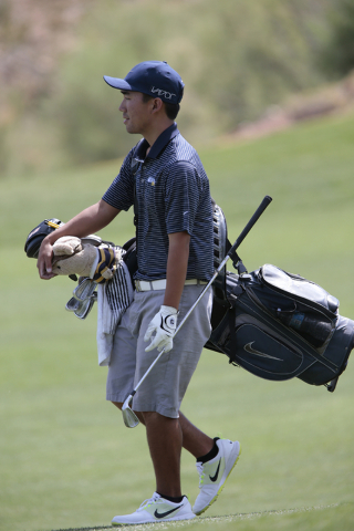 Foothill High School Senior Andrew Chu, carries his golf bag on the course during final roun ...