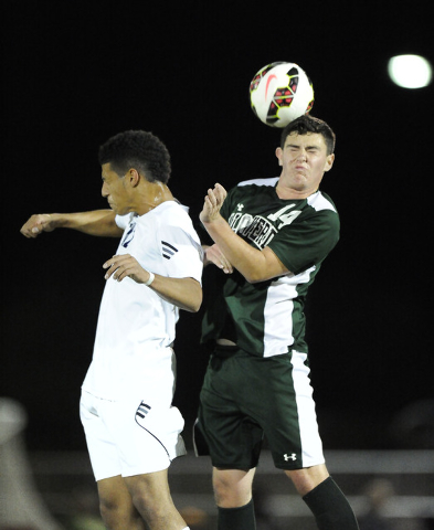 Palo Verde defender Daniel Venezia (14) and Shadow Ridge striker Joel Perez (12) collide whi ...