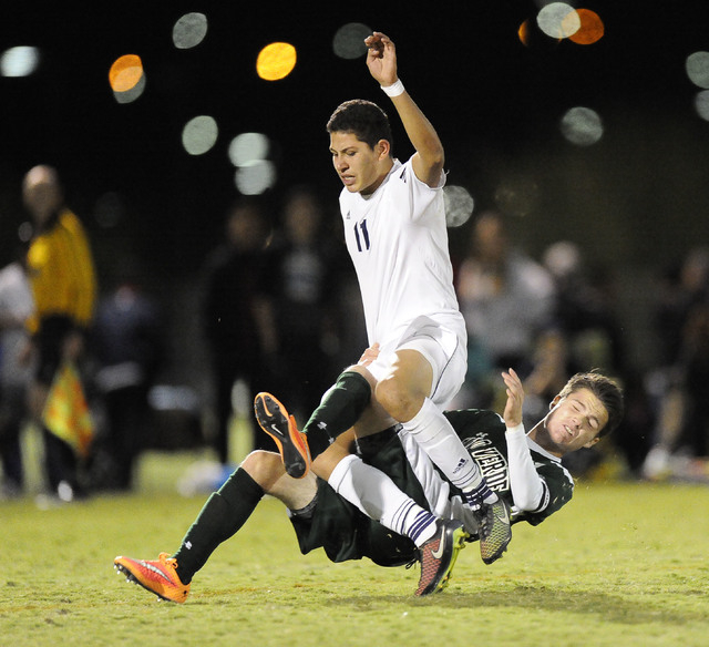 Shadow Ridge midfielder Alejandro Pacheco (11) collides with Palo Verde midfielder Austin Ma ...