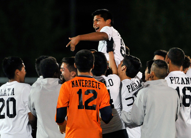 Las Vegas High School’s Efrain Pinal is carried by his teammates after his winning goa ...
