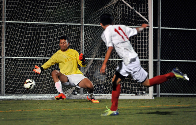 Valley High School’s Marco Gonzales (11) shoots the ball past Eldorado goalie Roberto ...