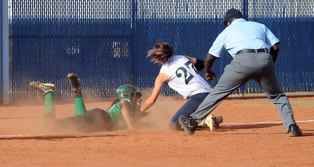 Rancho’s Kayla Coles, left, slides in under the tag of Foothill’s Katelyn Enzwei ...