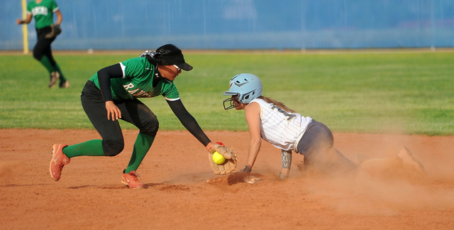 Foothill’s Jordan Corn slides into second with a stolen base as Rancho shortstop Tiare ...