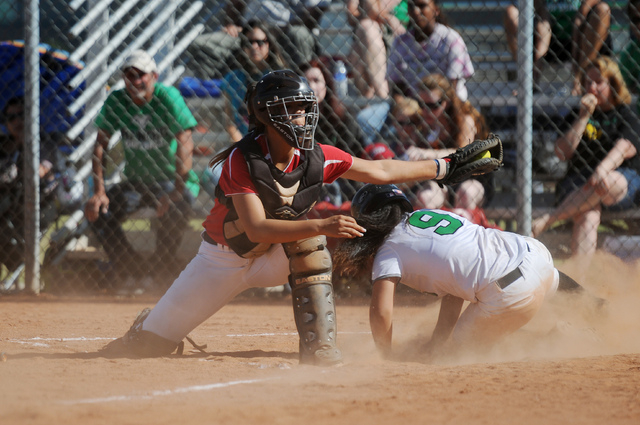 Rancho’s Sammi Llamas (9) beats the tag by Coronado catcher Basia Query (9) in the Sun ...