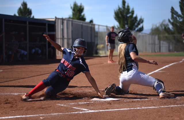 Coronado’s Taylor Okamura (10) scores at home plate against Foothill’s Haleigh O ...