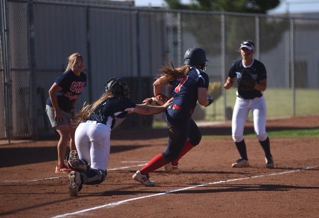 Foothill’s Kaleigh Olive (1) tags out Coronado’s Ashley Ward (7) during their so ...