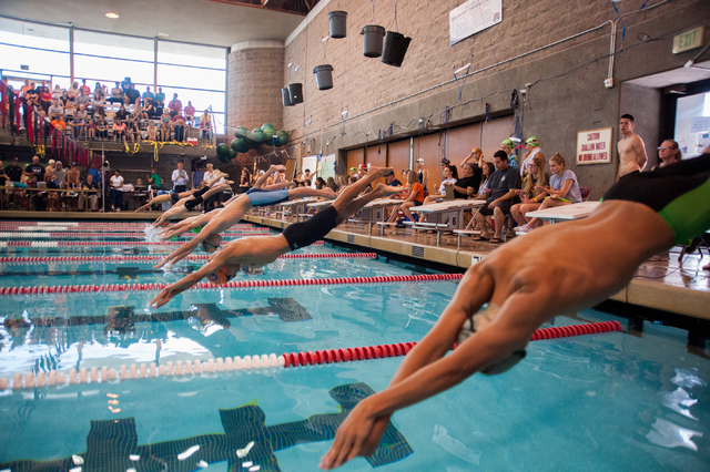 The boys dive in for the start of the 200-yard freestyle race at the Sunset Region meet on S ...