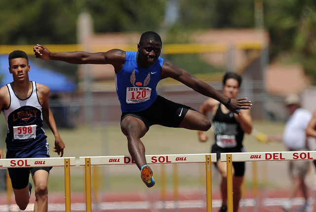 Tyjon Lindsey of Bishop Gorman wins a Sunset Region boy’s 300-meter hurdle heat with a ...