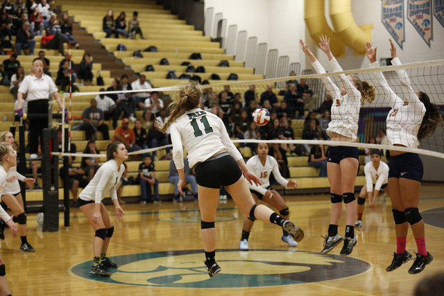 Palo Verde’s kendall Cheval (11) hits the ball past Legacy’s Hannah Bennet (9) a ...