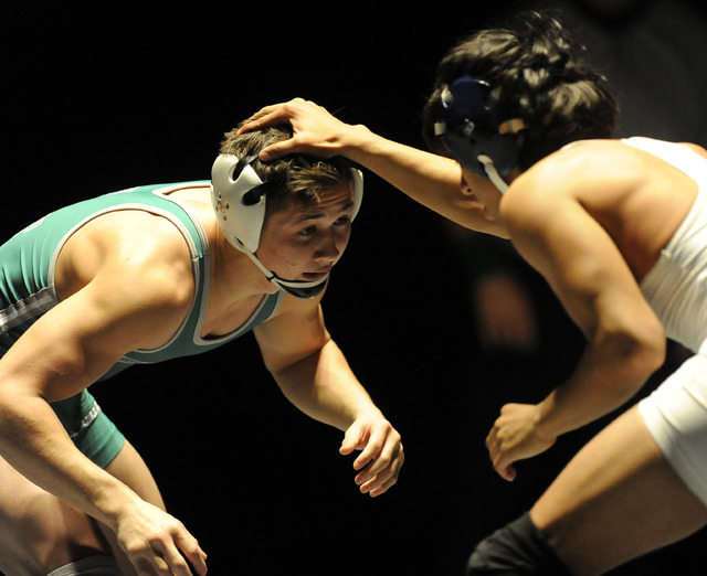 Green Valley’s Sean Cannon, left, wrestles Liberty’s Michael Martinez during the ...