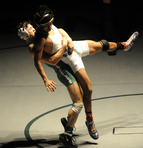 Green Valley’s Sean Cannon slams Liberty’s Michael Martinez to the mat during th ...