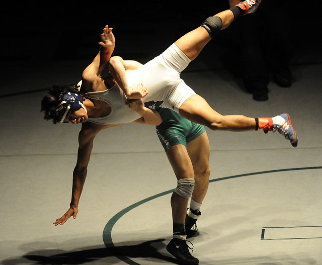 Green Valley’s Sean Cannon slams Liberty’s Michael Martinez to the mat during th ...