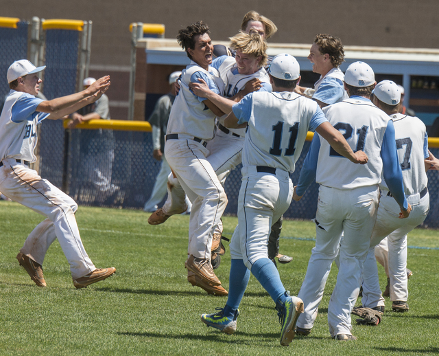 Centennial players celebrate their 8-4 victory over Bishop Gorman in the Sunset Region baseb ...