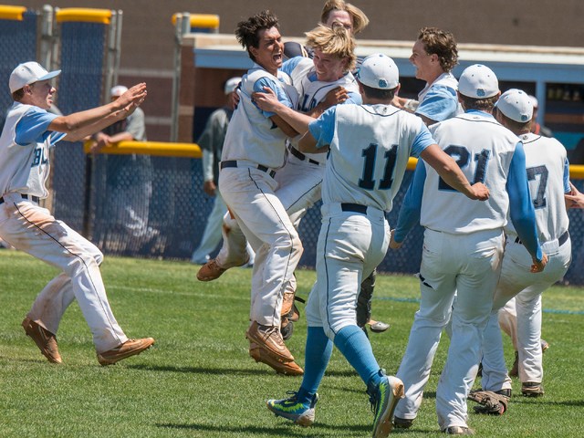 Centennial players celebrate their 8-4 victory over Bishop Gorman in the Sunset Region baseb ...