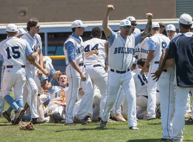 Centennial players celebrate their 8-4 victory over Bishop Gorman in the Sunset Region baseb ...