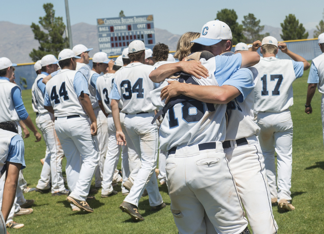 Centennial’s (18) Hayden Grant and (7) Paydon Prescott celebrate their 8-4 victory ove ...