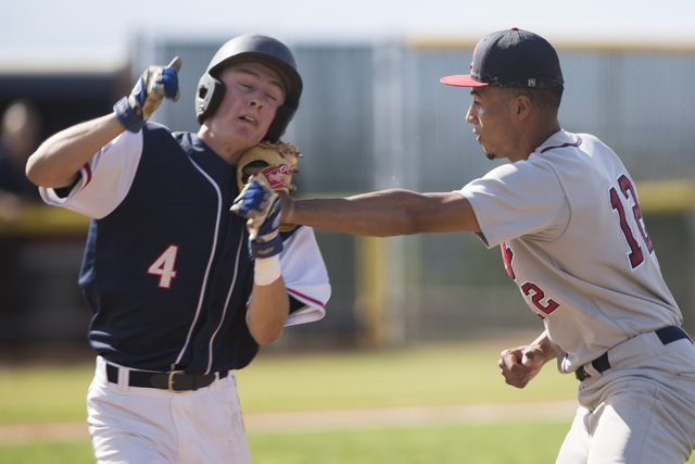 Coronado’s Kyle Hall (4) is tagged for an out by Liberty’s Edward O’Bannon ...