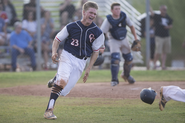 Coronado’s Garrett Lake (23) reacts after scoring the winning run against Liberty in t ...