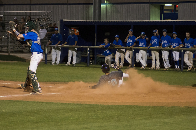 Silverado’s Kevin Chase Cortez (10) slides across home plate during their game against ...