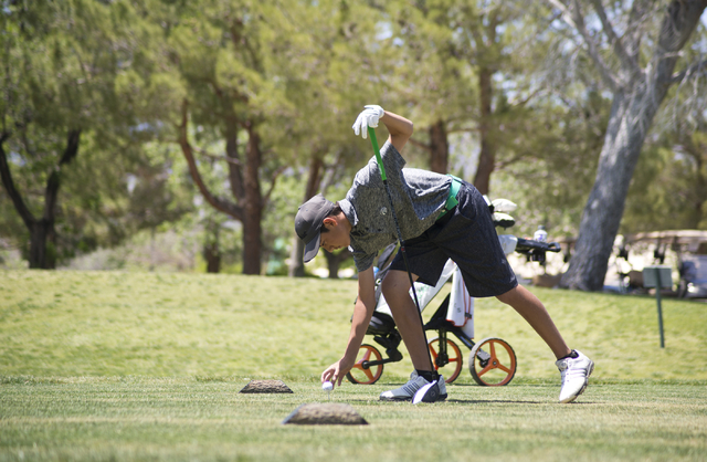 Cameron Barzekoff of Palo Verde High School tees up his ball during the Sunset Region boys g ...