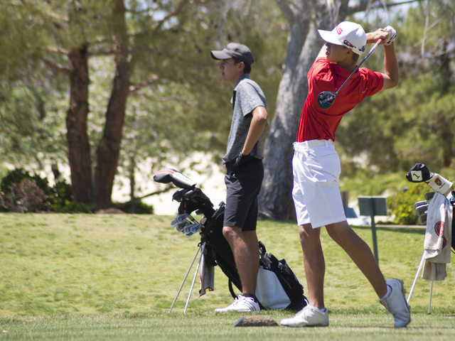 Arbor View’s Hazen Newman hits his ball during the Sunset Region boys golf tournament ...