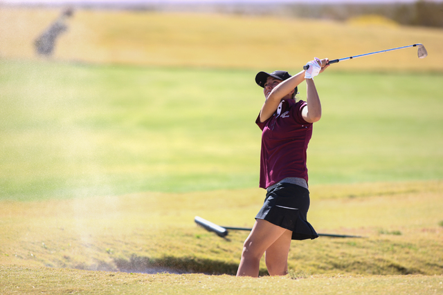 Faith Lutheran’s Julia Becker hits the ball out of a bunker during the Division I-A So ...
