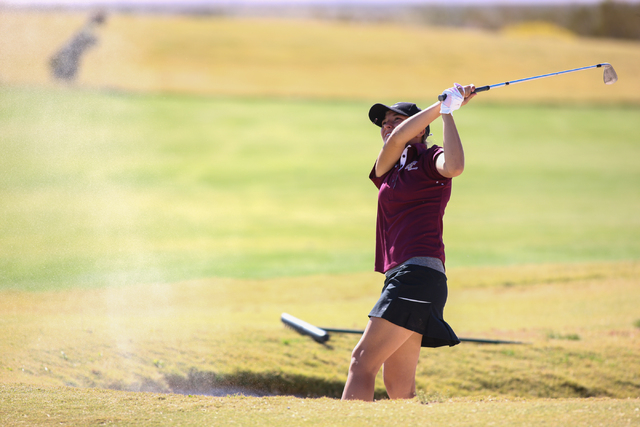 Faith Lutheran’s Julia Becker hits the ball out of a bunker during the Division I-A So ...