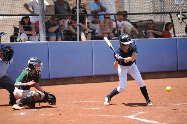 Centennial’s Lacie Chakos, right, prepares to swing at a pitch during the Sunset Regio ...