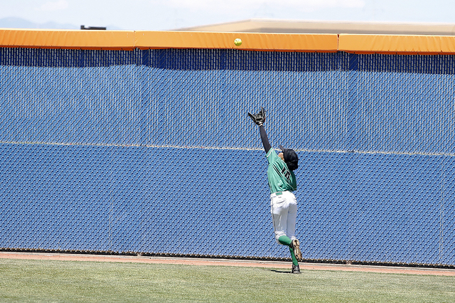 Jahnae Davis-Houston of Rancho catches a fly ball against Liberty during their prep softball ...