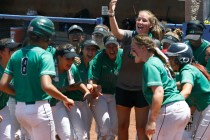Rancho players gather at home base to congratulate teammate Kayla Coles on her home run agai ...