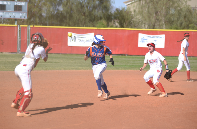 Bishop Gorman’s Kasey Bilodeau (2), center, gets caught in a run down as Arbor View&#8 ...