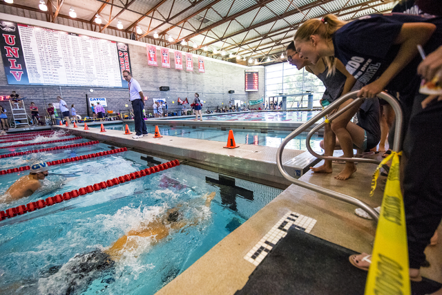 Students cheer on swimmers during the Sunrise Region high school swim meet at the Bucky Buch ...
