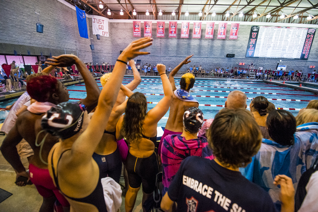 Students cheer on swimmers during the Sunrise Region high school swim meet at the Bucky Buch ...