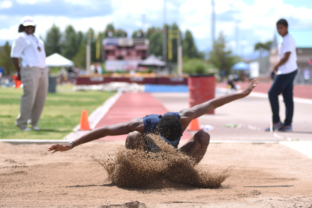 Canyon Springs Isaiah Johnson competes in the long jump event during the Division I region t ...