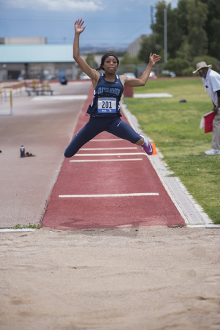 Canyon Springs Iyani Hayden competes in the triple jump event during the Division I region t ...