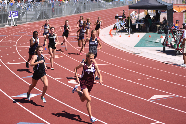 Girls compete in the 1600-meter run at the Sunset Region meet held at Del Sol High School in ...