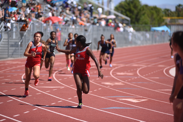 Arbor View teammates compete in the girls 800-meter relay at the Sunrise Region meet held at ...